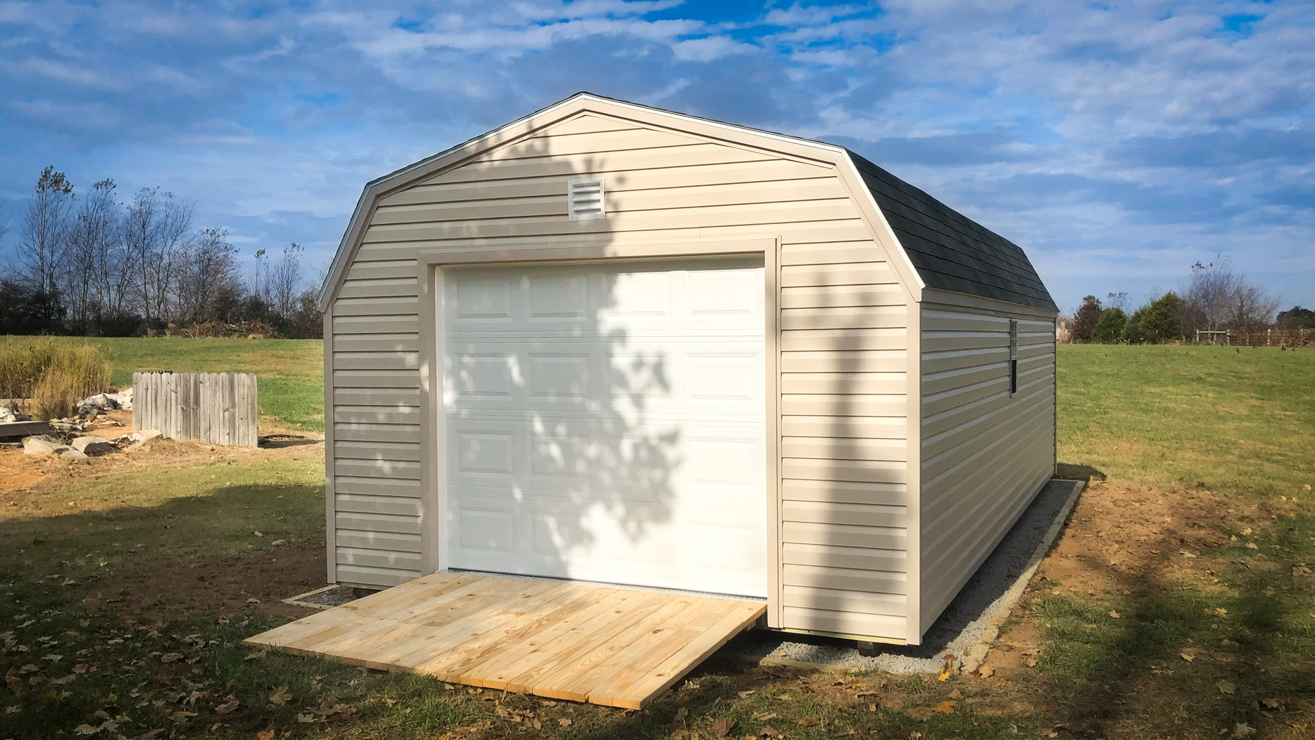 exterior of tan portable garage shed for sale