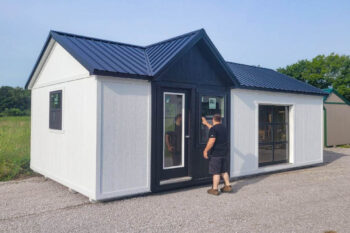 white ranch tiny house shells with dormer and black metal roof